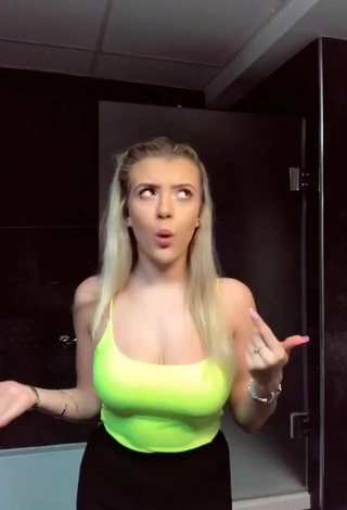 2. Sultry Molly Marsh Shows Cleavage in Yellow Tank Top