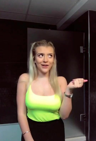 3. Sultry Molly Marsh Shows Cleavage in Yellow Tank Top