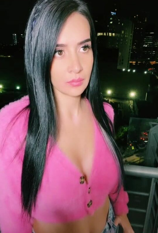 3. Seductive Adriana Valcárcel Shows Cleavage in Pink Crop Top on the Balcony