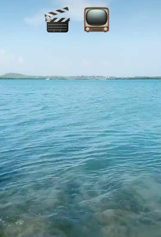 5. Titillating Adriana Valcárcel in Yellow Bikini in the Sea