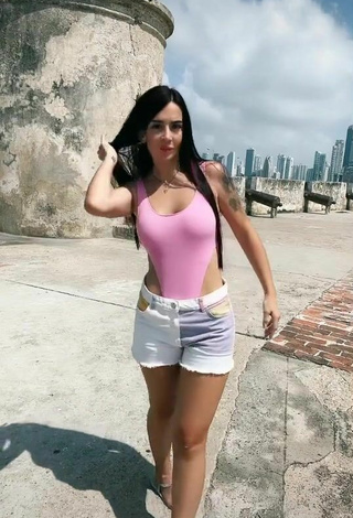 Titillating Adriana Valcárcel in Pink Swimsuit in a Street