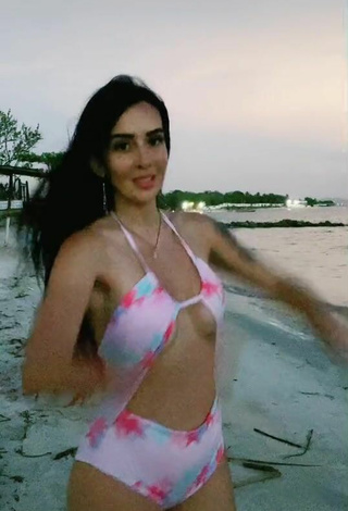 2. Luscious Adriana Valcárcel in Floral Swimsuit at the Beach (Side Boob)