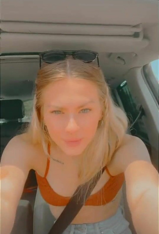 Luscious Ali Mykal in Orange Hot Top in a Car