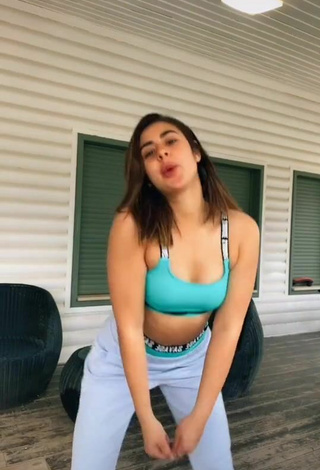 Sexy Angel Baranes Shows Cleavage in Green Sport Bra