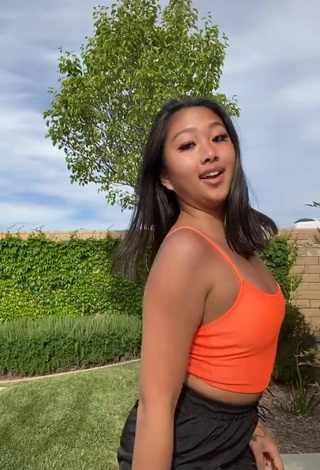 3. Breathtaking Anneston Pisayavong in Orange Crop Top