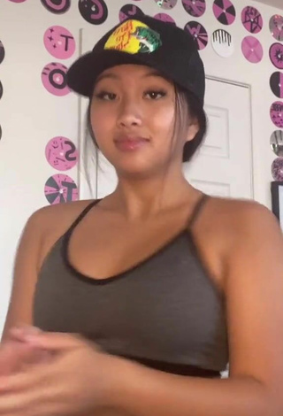 4. Luscious Anneston Pisayavong Shows Cleavage in Grey Sport Bra