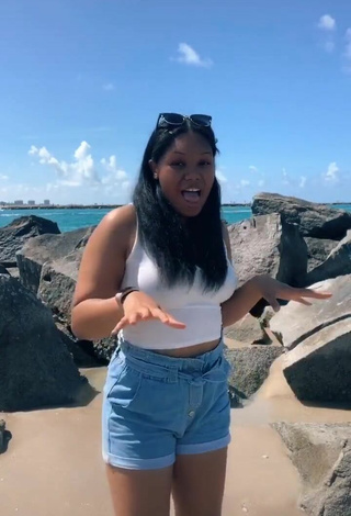 2. Sultry Asha Christine in White Crop Top at the Beach