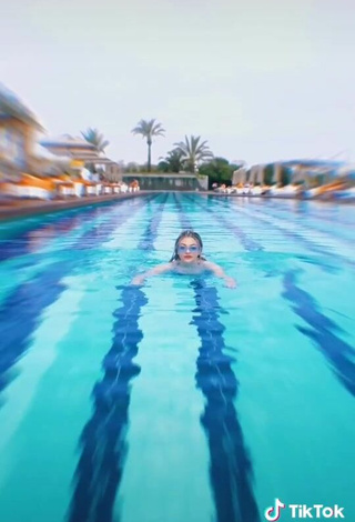 4. Sultry Asya Burcum in Blue Swimsuit at the Pool