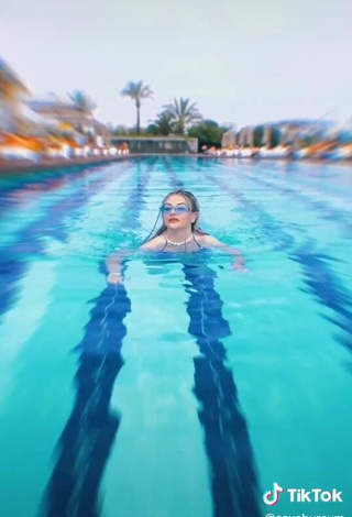 5. Sultry Asya Burcum in Blue Swimsuit at the Pool