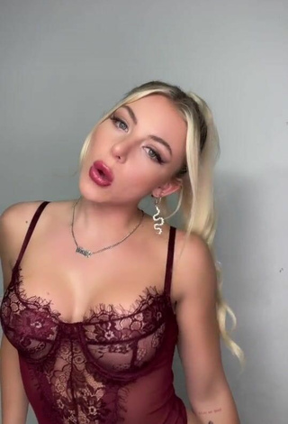 Sultry Brittanie Nash Shows Cleavage in Red Bodysuit