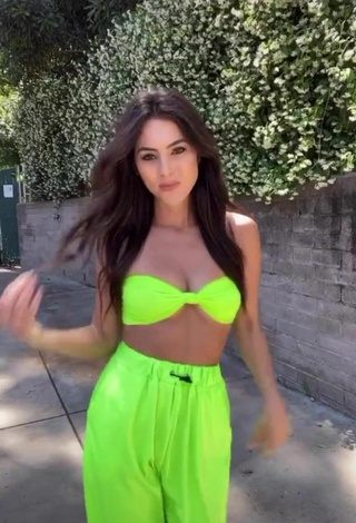 Luscious Brooke Bridges Shows Cleavage in Lime Green Crop Top