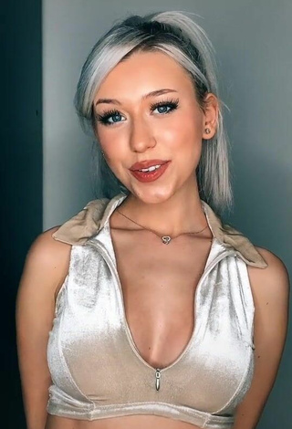 Sultry Alexis Feather Shows Cleavage in Silver Crop Top