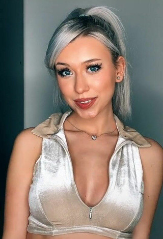 2. Sultry Alexis Feather Shows Cleavage in Silver Crop Top