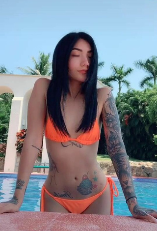 4. Sultry Nicole Amado in Electric Orange Bikini at the Pool