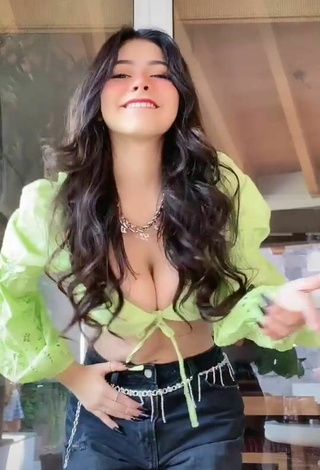 2. Titillating Aylin Criss Shows Cleavage in Lime Green Crop Top