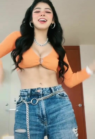 Sexy Aylin Criss Shows Cleavage in Orange Crop Top