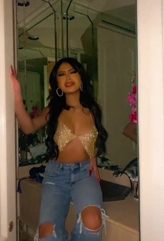 Desiree Montoya Shows Cleavage in Alluring Silver Crop Top