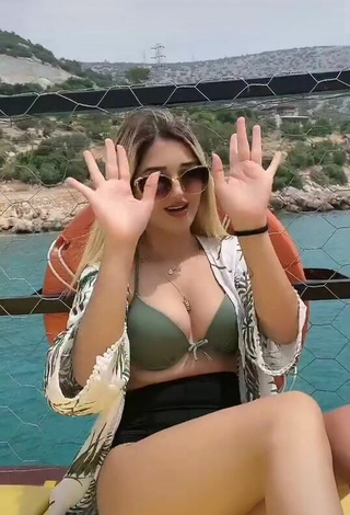 2. Sultry Eda Aslankoç Shows Cleavage in Olive Bikini on a Boat