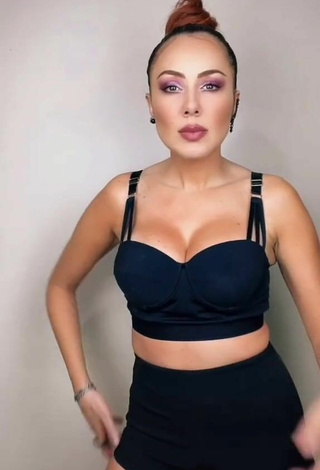 Sultry Erika Shows Cleavage in Black Crop Top