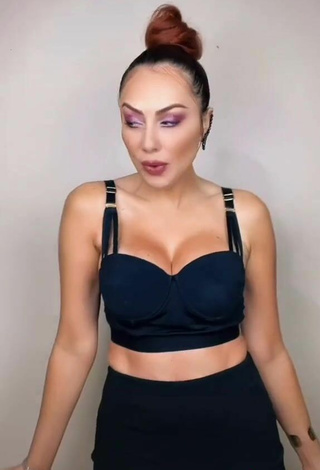 2. Sultry Erika Shows Cleavage in Black Crop Top