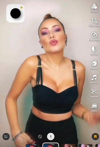 3. Sultry Erika Shows Cleavage in Black Crop Top