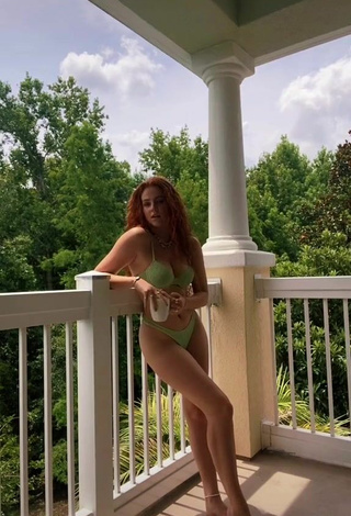 2. Cute Faith Collins in Green Bikini on the Balcony