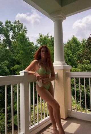 5. Cute Faith Collins in Green Bikini on the Balcony