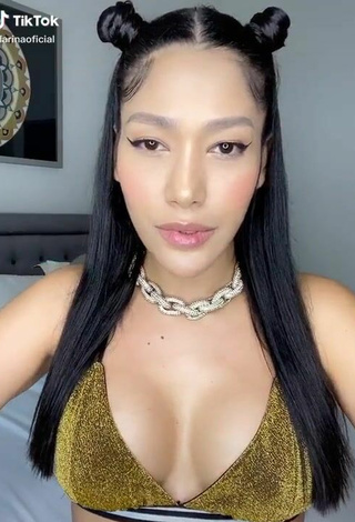 Luscious Farina Shows Cleavage in Golden Bikini Top