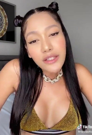 4. Luscious Farina Shows Cleavage in Golden Bikini Top