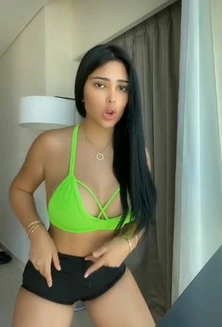 5. Sweetie Franjomar Shows Cleavage in Green Crop Top