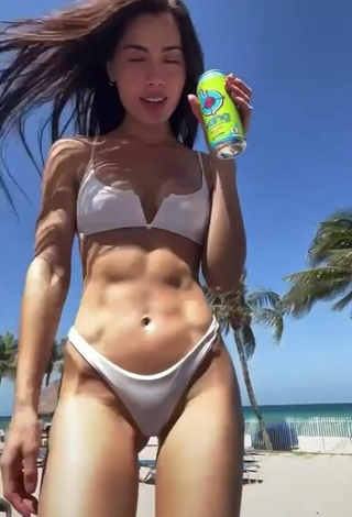 2. Seductive Georgina Mazzeo Shows Cleavage in White Bikini at the Beach