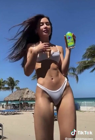 3. Seductive Georgina Mazzeo Shows Cleavage in White Bikini at the Beach