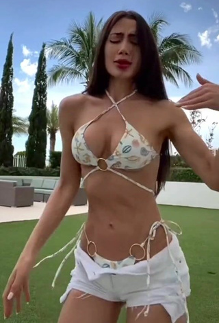 2. Hottie Georgina Mazzeo Shows Cleavage in Bikini Top