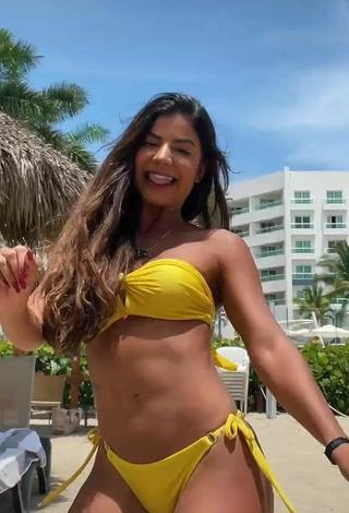 5. Titillating Hariany Nathália Almeida Shows Cleavage in Yellow Bikini at the Beach