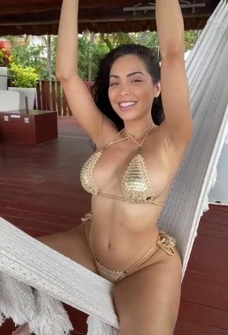 3. Titillating Maddy Belle Shows Cleavage in Golden Bikini