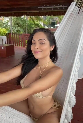 2. Really Cute Maddy Belle Shows Cleavage in Golden Bikini