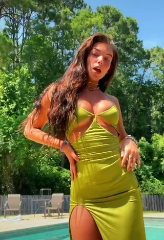 3. Sultry Jordan Beckham in Green Dress at the Pool