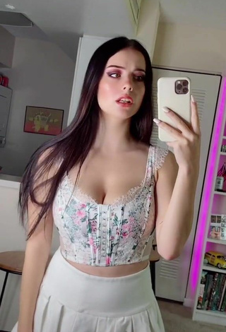 Titillating Julia Burch Shows Cleavage in Floral Crop Top