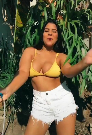 2. Dazzling Julia Antunes Shows Cleavage in Inviting Yellow Bikini Top