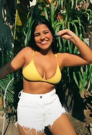 4. Dazzling Julia Antunes Shows Cleavage in Inviting Yellow Bikini Top