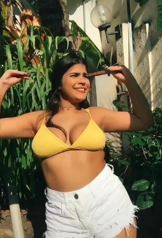 Hottie Julia Antunes Shows Cleavage in Yellow Bikini Top