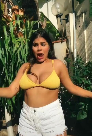 2. Hottie Julia Antunes Shows Cleavage in Yellow Bikini Top