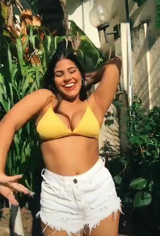 5. Hottie Julia Antunes Shows Cleavage in Yellow Bikini Top