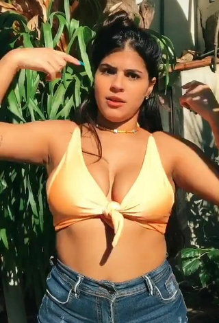 2. Julia Antunes Shows Cleavage in Alluring Yellow Bikini Top and Bouncing Tits