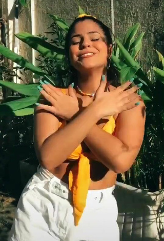 2. Julia Antunes Looks Sexy in Yellow Bikini Top