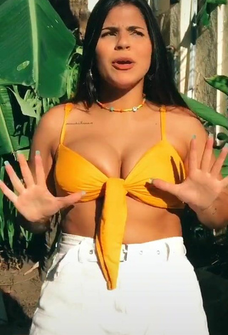 2. Magnificent Julia Antunes Shows Cleavage in Yellow Bikini Top