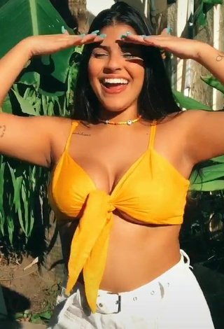 5. Magnificent Julia Antunes Shows Cleavage in Yellow Bikini Top