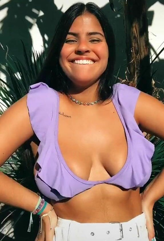 Julia Antunes Shows Cleavage in Cute Purple Bikini Top