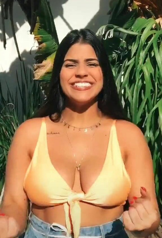 Hottest Julia Antunes Shows Cleavage in Yellow Bikini Top