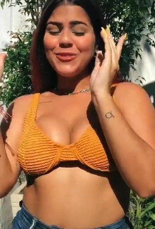 3. Hot Julia Antunes Shows Cleavage in Orange Bikini Top